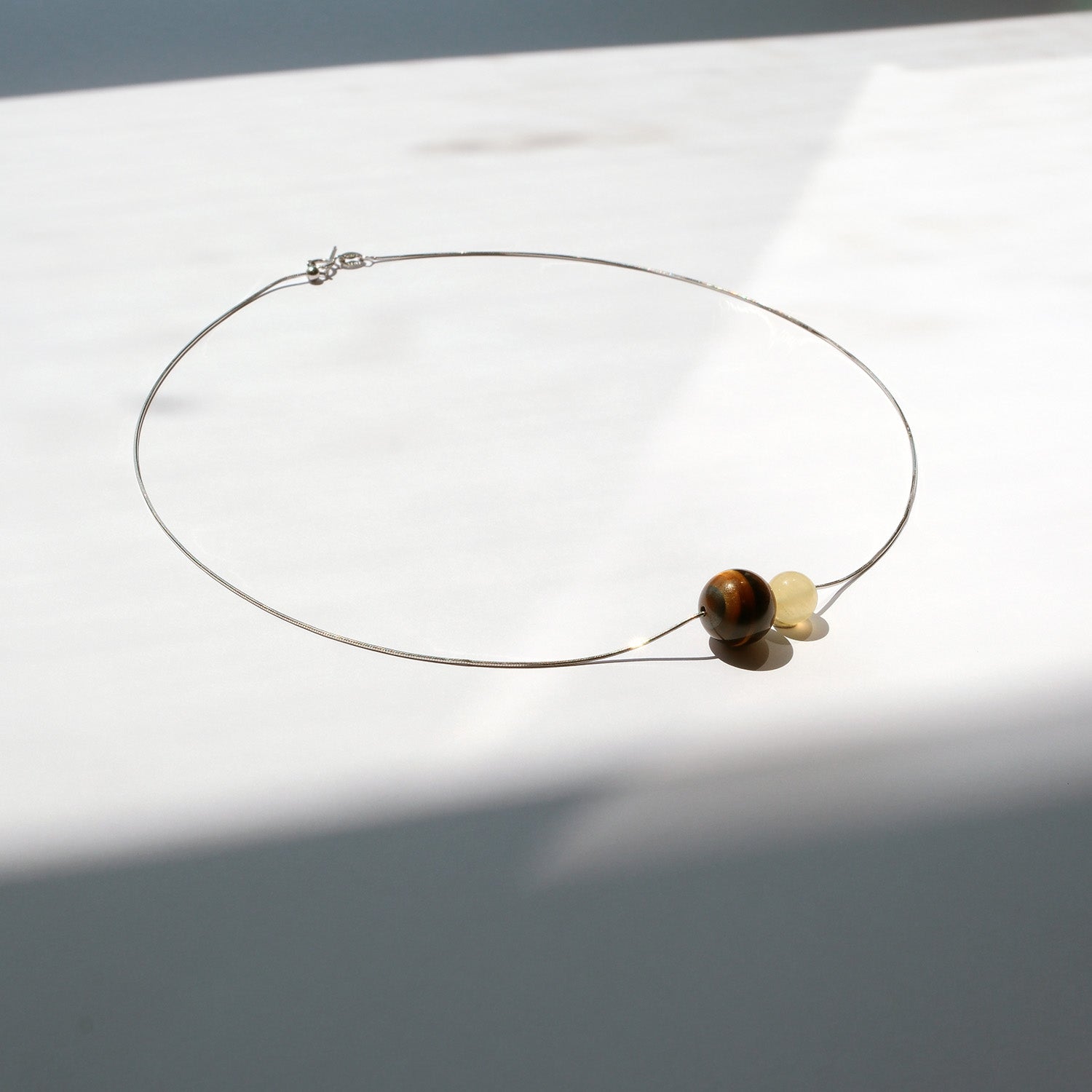 Brown and golden gemstone necklace from Double Star Collection – ideal for career growth, interviews, and leadership.