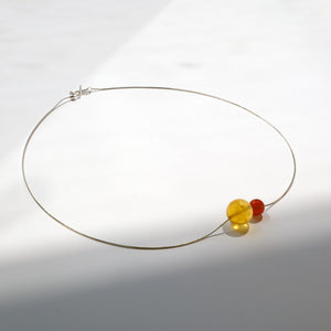 Golden and red gemstone necklace from Double Star Collection – bold jewellery for courage, action, and achievement.