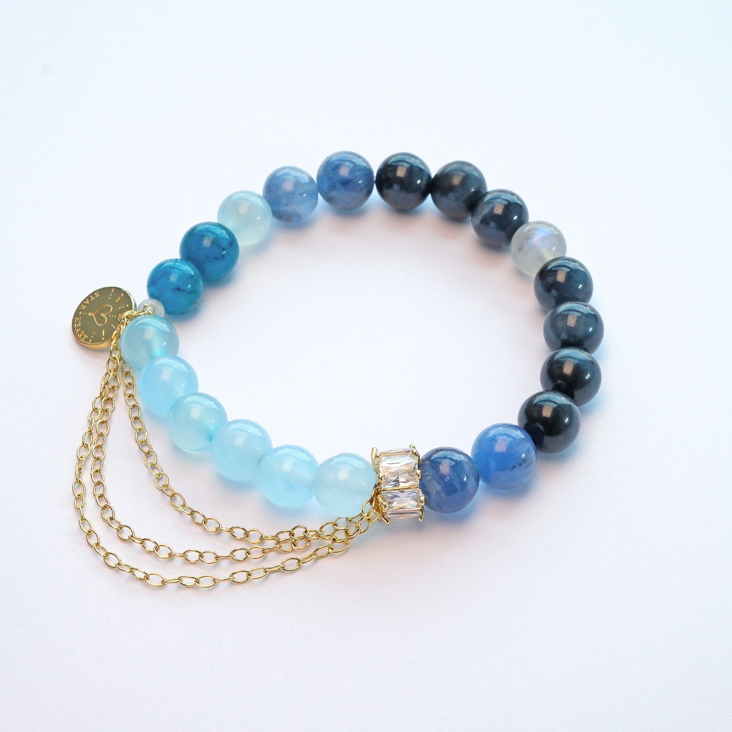 Close-up of kyanite and aquamarine crystal bracelet for professional growth