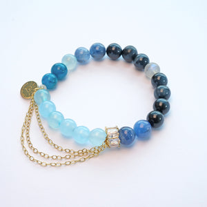 Close-up of kyanite and aquamarine crystal bracelet for professional growth