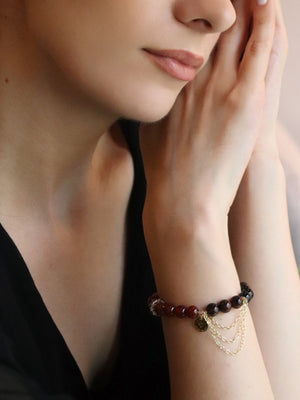 Lifestyle shot of woman with Carnelian bracelet for emotional resilience