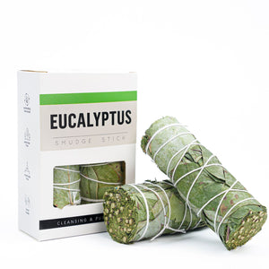 Eucalyptus smudge sticks with packaging on a white background