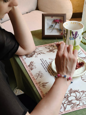 Woman wearing kyanite and rose quartz bracelet for creativity and balance