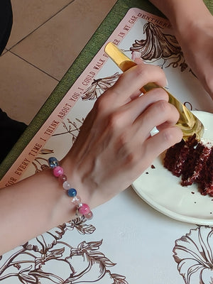 Lifestyle shot of woman with kyanite crystal bracelet for healing energy