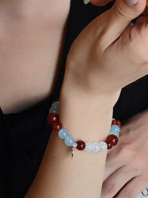 Woman wearing Orion Nebula crystal bracelet for ambition and courage