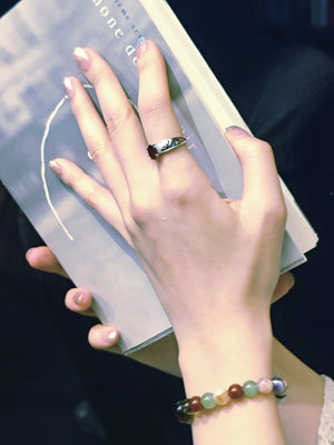 Lifestyle shot of woman with natural crystal bracelet for health