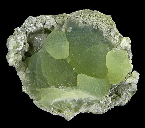 Raw prehnite gemstone in soft translucent green, crystal of peace, healing and intuition