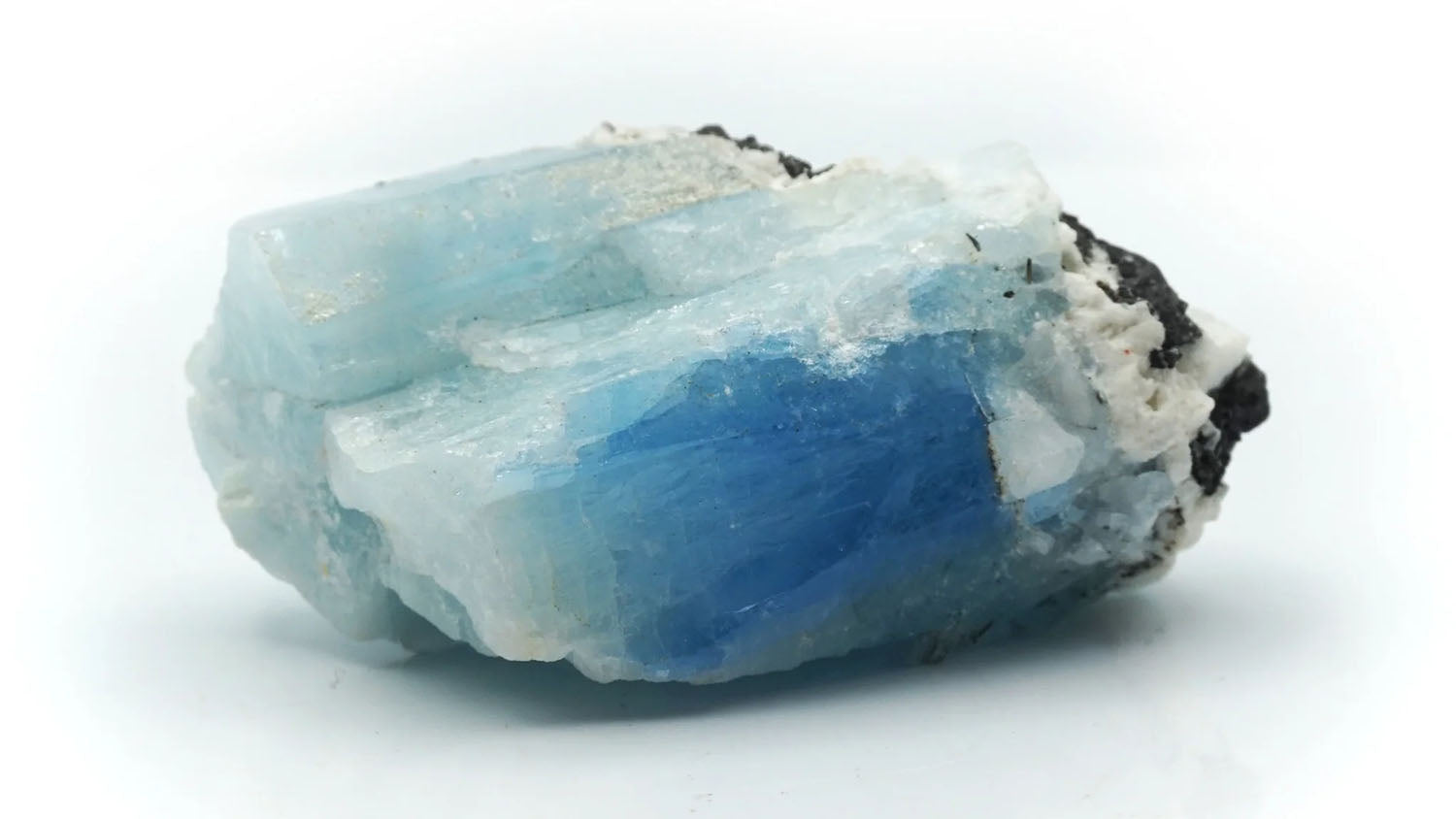 Raw aquamarine crystal with light blue translucent tones, gemstone of serenity and courage