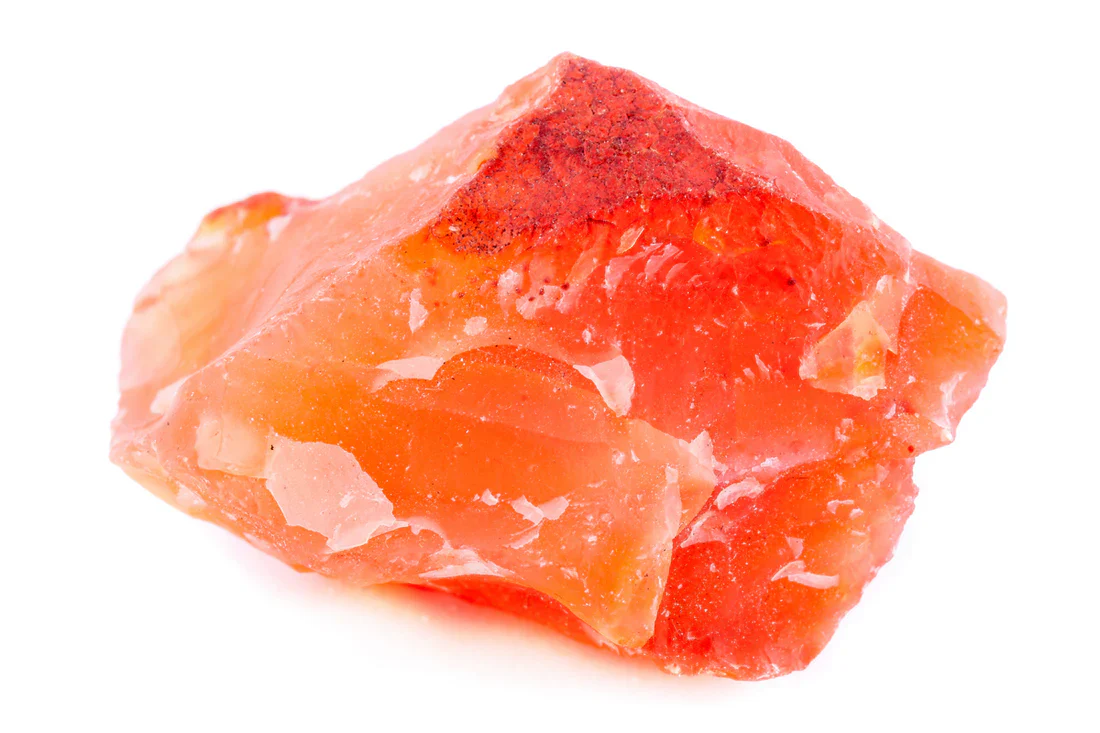 Raw carnelian crystal in warm orange-red tones, gemstone of courage, vitality and creativity