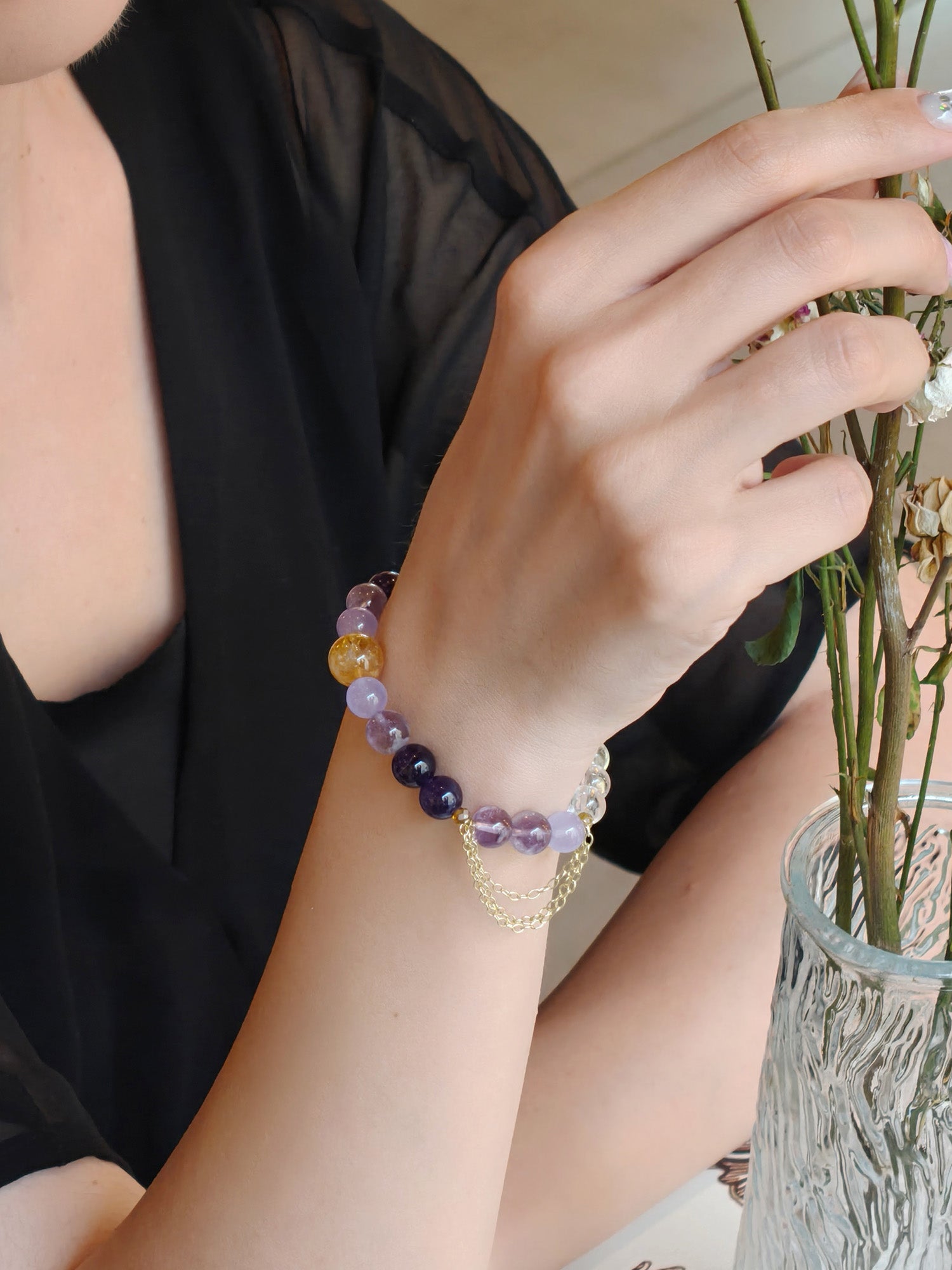 Woman wearing amethyst crystal bracelet for clear thinking and focus