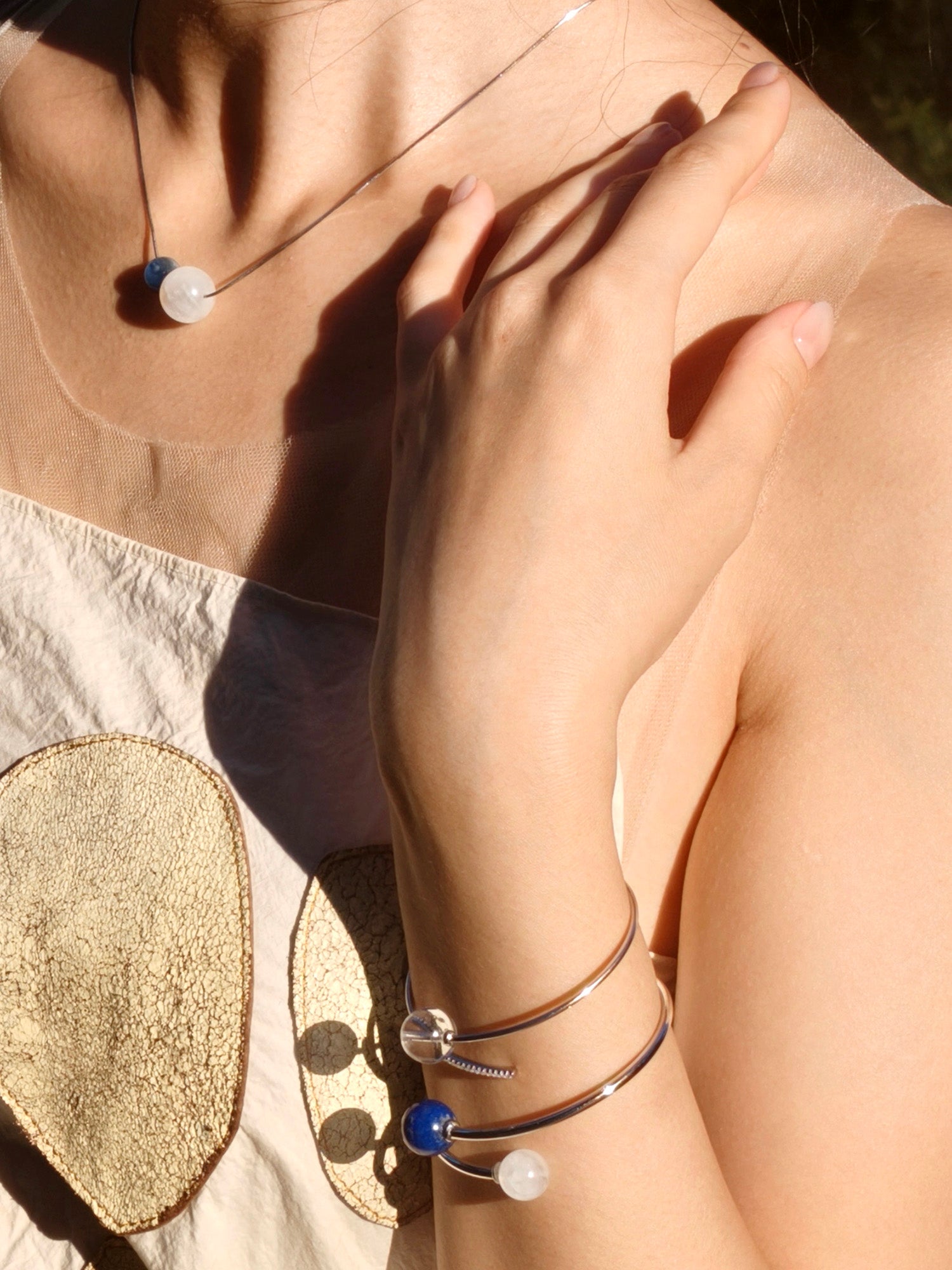 what do you wear for a classy party? Sterling silver necklace with moonstone and kyanite beads – unique gift for birthdays, holidays, or new ventures.
Sterling silver bracelet – lapis lazuli and moonstone crystal pairing for clarity.