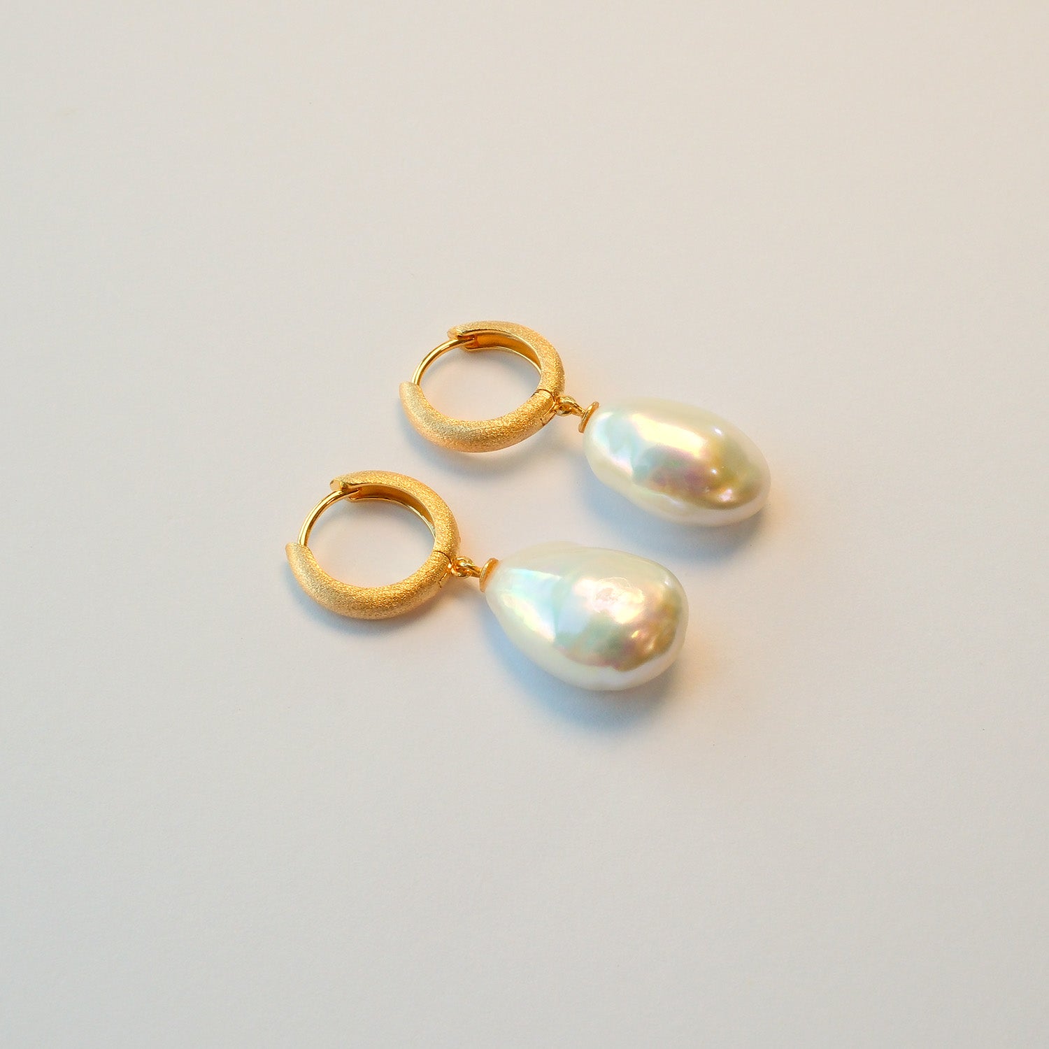 Teardrop baroque pearl drop earrings: symbol of freedom beyond rules UK jewellery