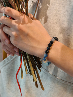 Man wearing aquamarine bracelet for focus and motivation no chain