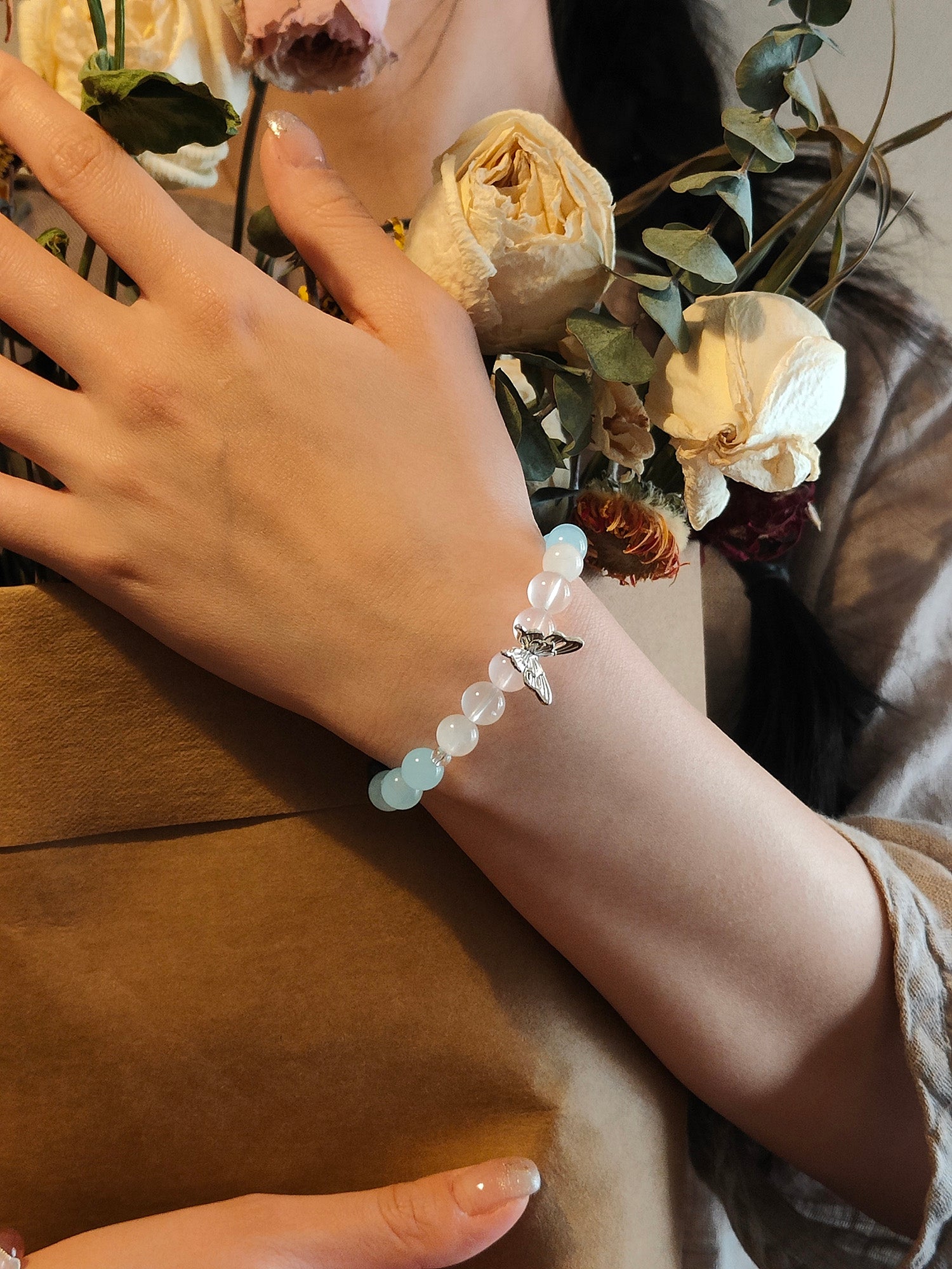 Lifestyle shot of blue crystal bracelet for spiritual clarity and communication