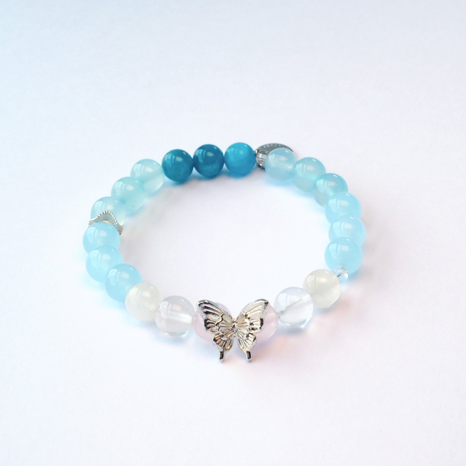 Butterfly Nebula bracelet collection with silver butterfly accents in blue and pink variations