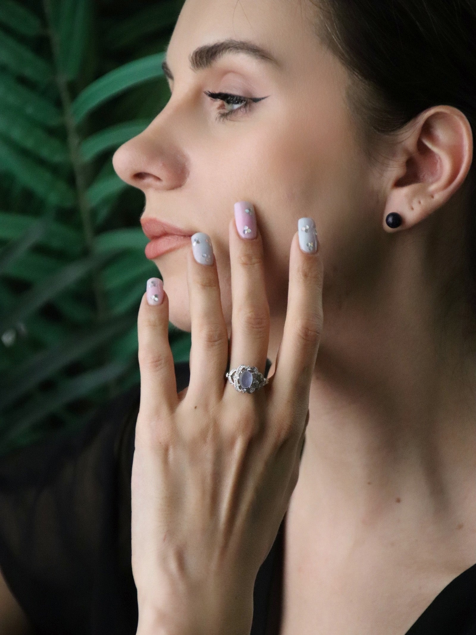 woman wearing Aquamarine gemstone ring symbolising serenity and calm, affordable March birthstone gift for her