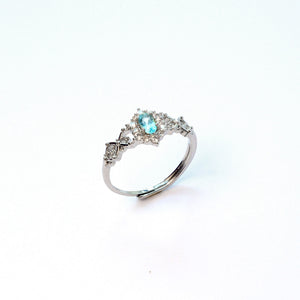 Swiss blue topaz everyday gem ring with vivid sky blue sparkle, symbol of clarity and expression