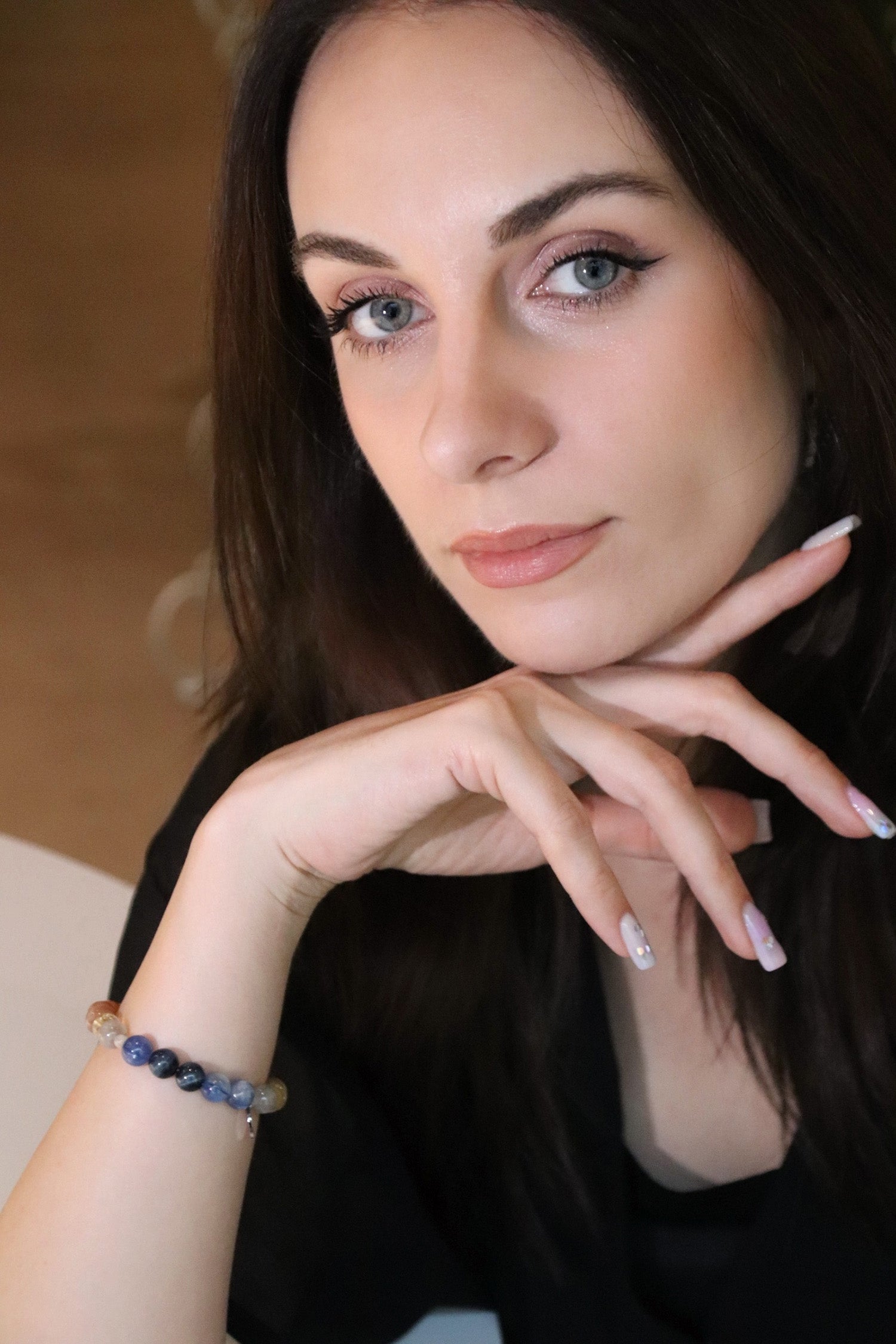 Lifestyle shot of woman with crystal bracelet for resilience