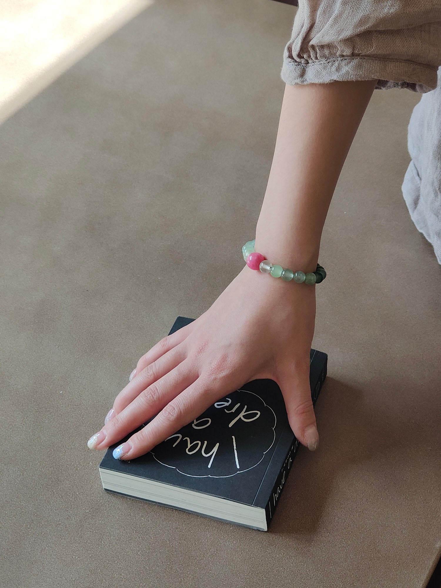 girl wearing green strawberry quartz bracelet for inspiration and creative flow