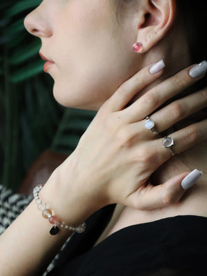 woman wearing Strawberry Quartz Sterling Silver Earrings and natural crystal bracelet