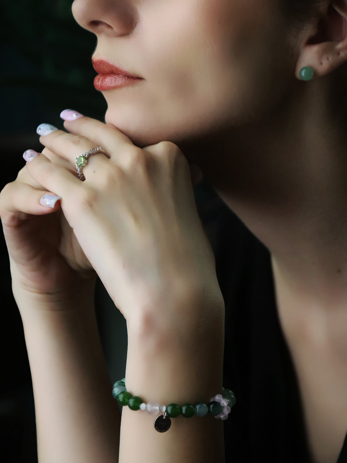 woman wearing Aventurine Jade Sterling Silver Earrings and Peridot ring