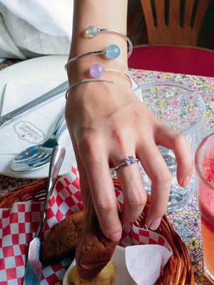 girl wearing lavender amethyst ring, sterling silver bracelet with aquamarine and prehite natural crystal. Sterling silver amethyst ring, ideal holiday gift for spiritual seekers
