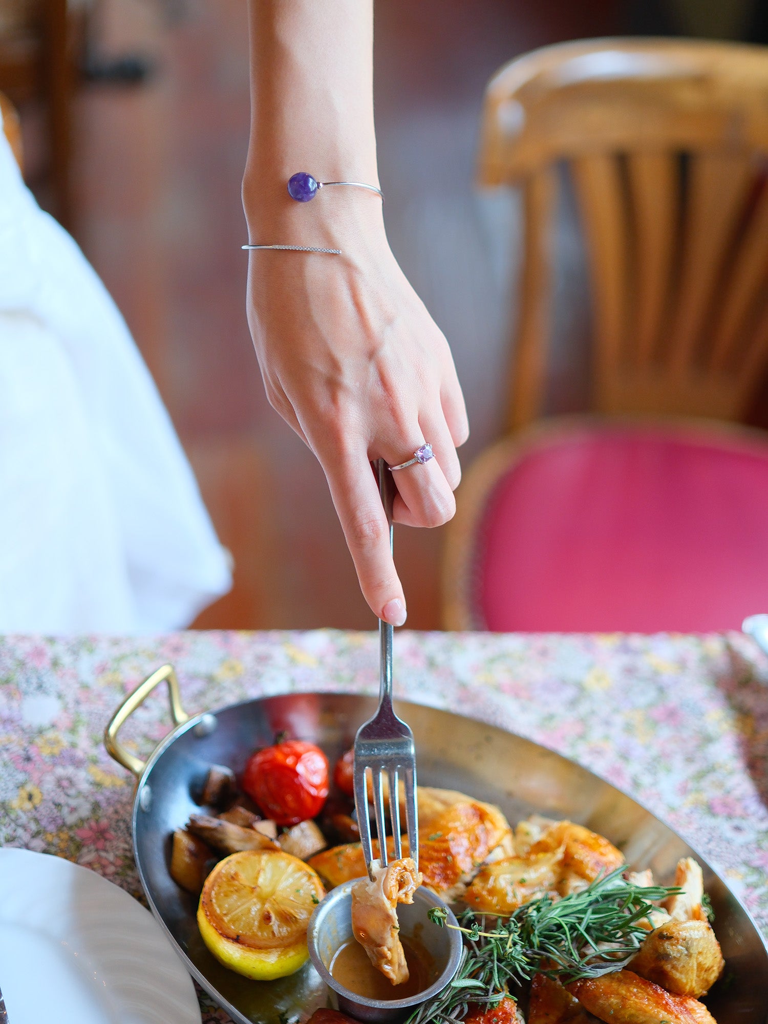 life style of wearing a lavender amethyst silver ring and comet amethyst silver bracelet for holiday dinner
