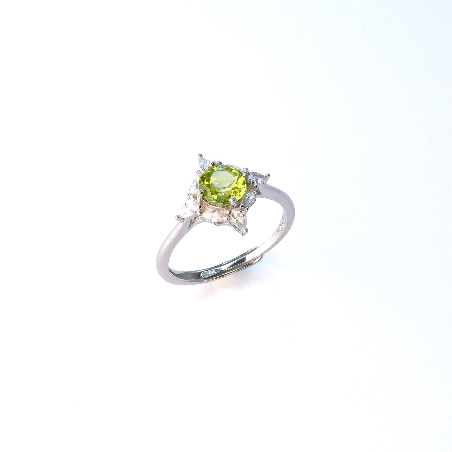Round peridot sterling silver ring for attracting prosperity in business meetings
