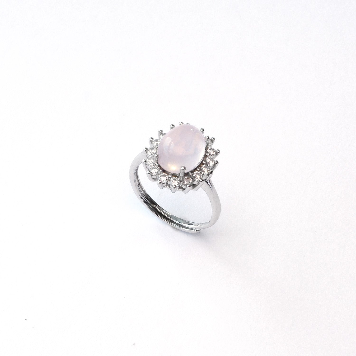 Rose quartz sterling silver ring radiating love and confidence in social gatherings
