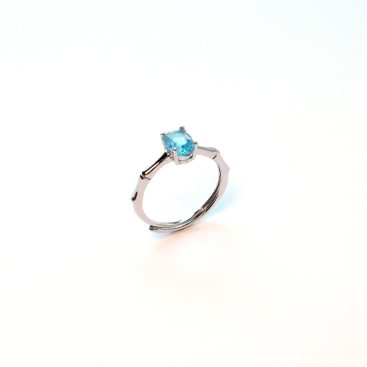 Swiss blue topaz sterling silver ring symbolising resilience at work and career growth
