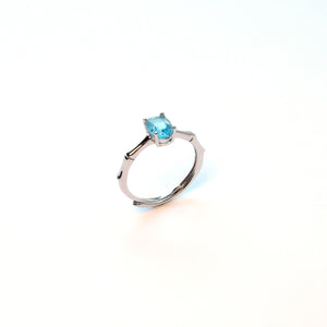 Swiss blue topaz sterling silver ring symbolising resilience at work and career growth
